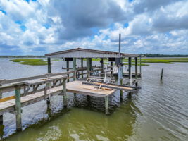 Dock with 2 boat lifts, new floating dock, fish cleaning station with sink