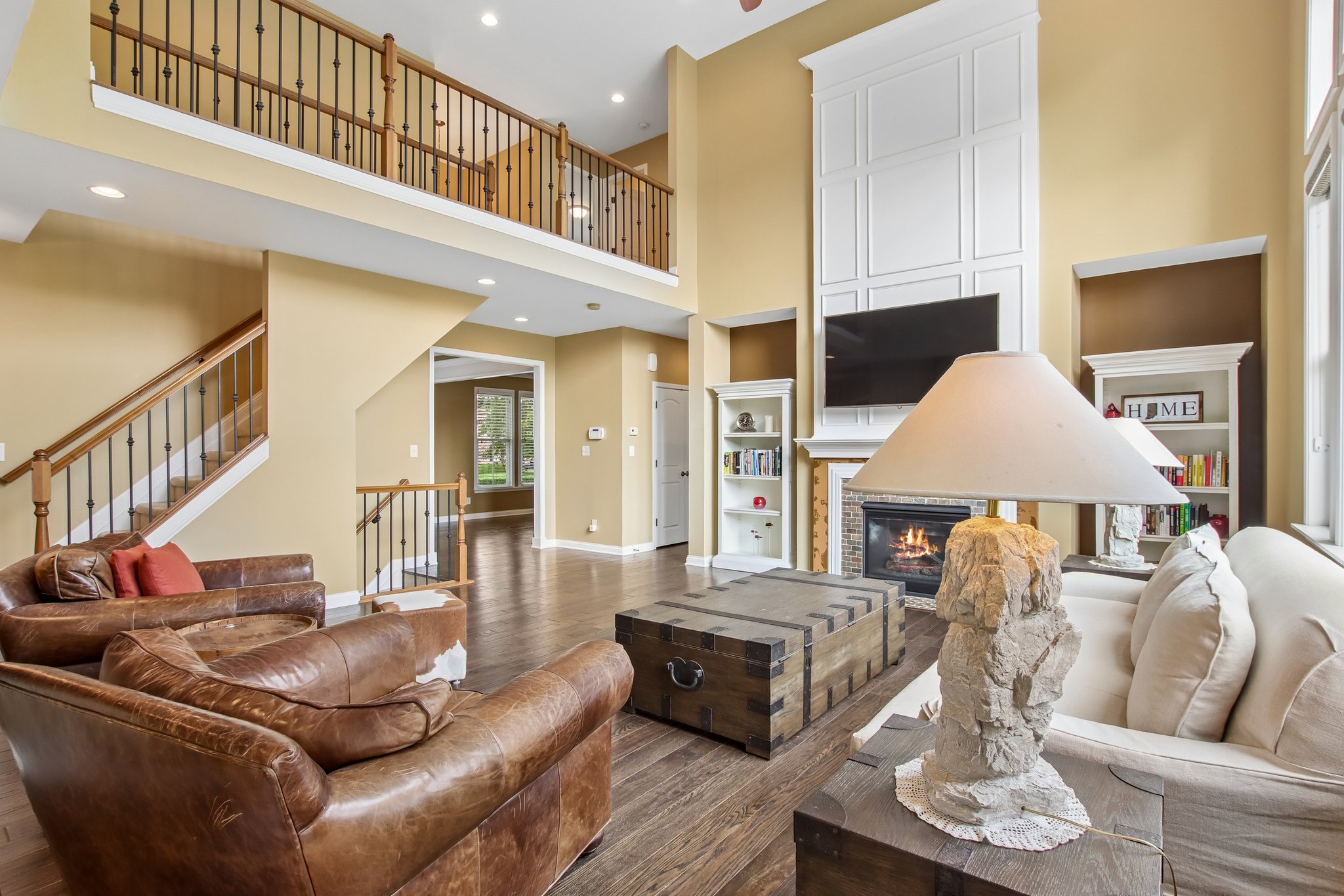 Open staircase overlooks the great room with tons of natural light