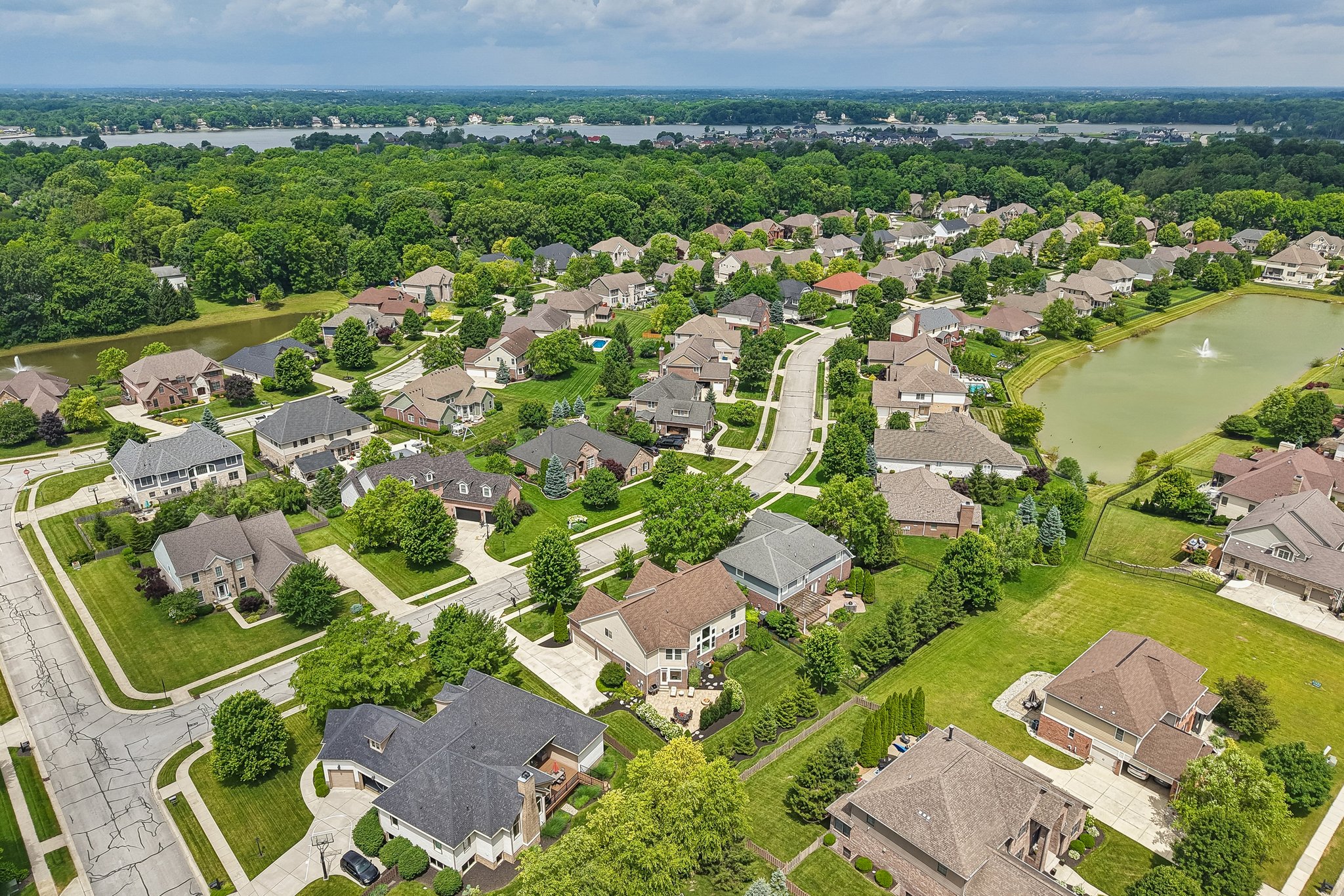 Aerial view of the home showing Geist Lake, less than a mile away