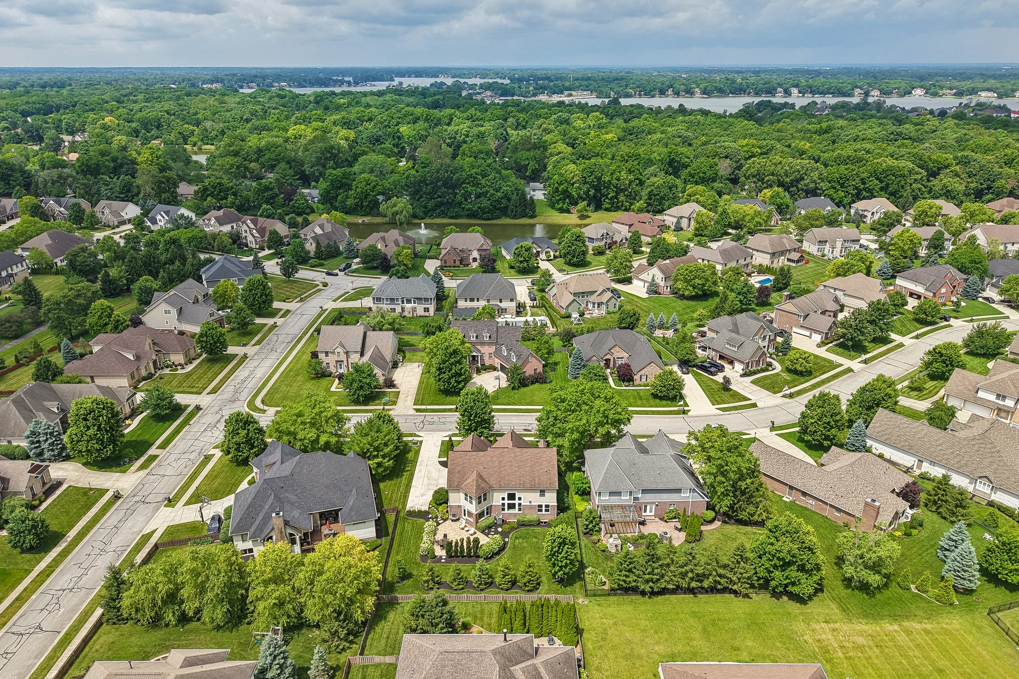 Aerial view of the home showing Geist Lake, less than a mile away