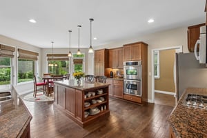 Kitchen offers large island, double oven, gas cooktop w/micro hood, refrigerator, dishwasher, and large walk-in pantry