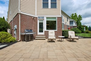 Enjoy dining al fresco and entertaining on the luxurious custom paver patio