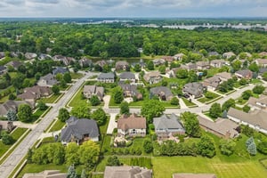 Aerial view of the home showing Geist Lake, less than a mile away