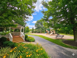 Community playground with swings, picnic table, gazebo in the neighborhood