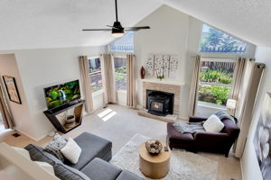 Living room with vaulted ceiling...