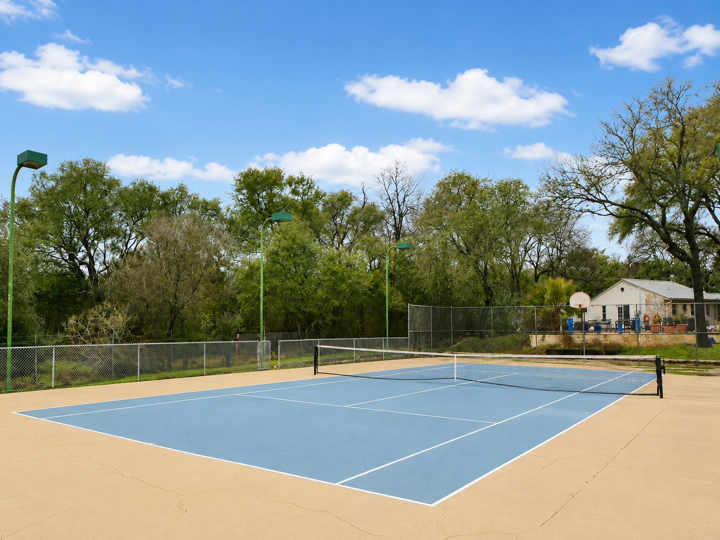 Court surface digitally enhanced to show potential after pressure washing.