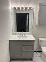 Custom lighting and mirror in guest bath