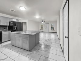 View from back door into kitchen and living area