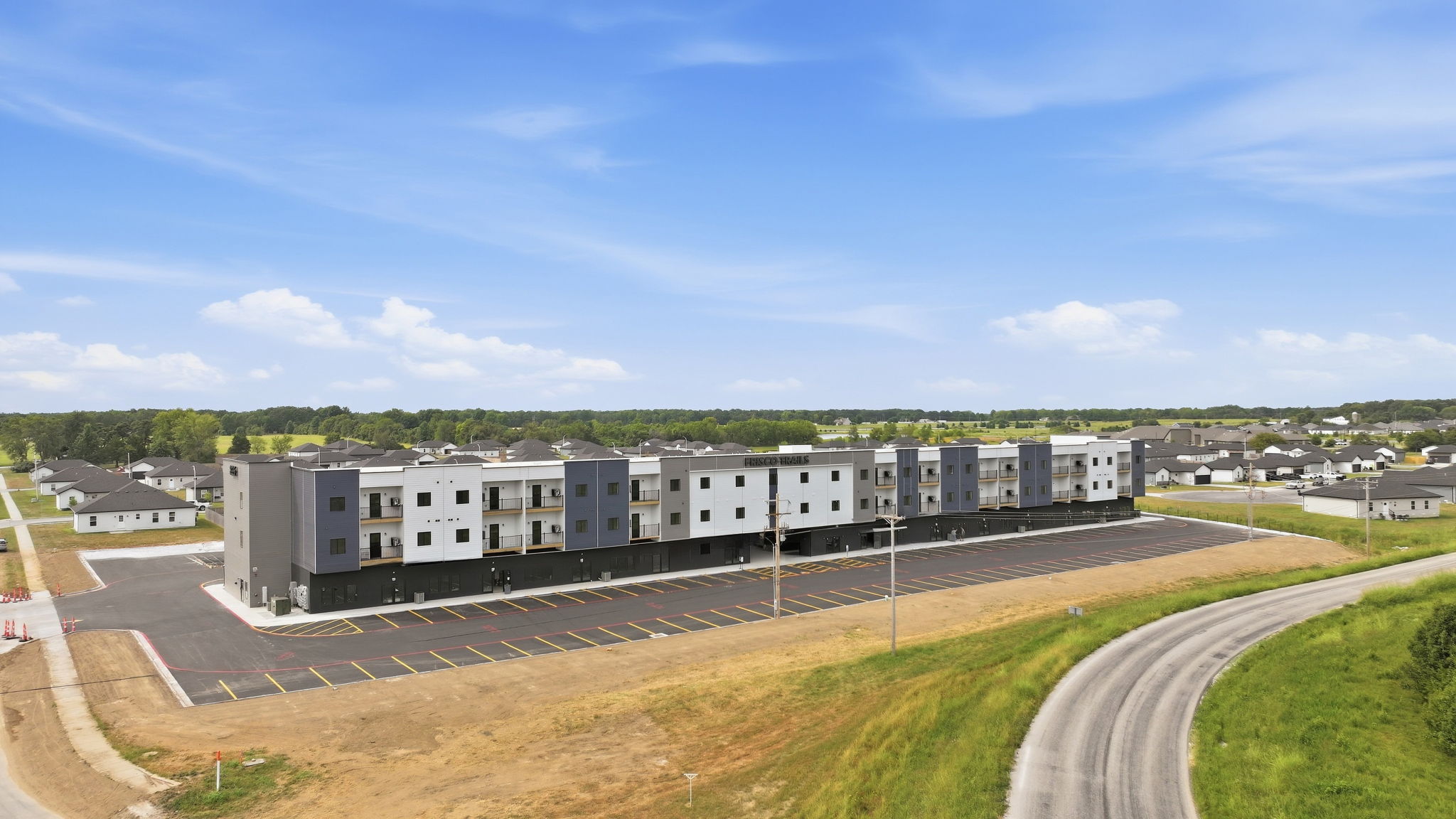 01 - Property Aerial - Front Exterior and Parking Lot