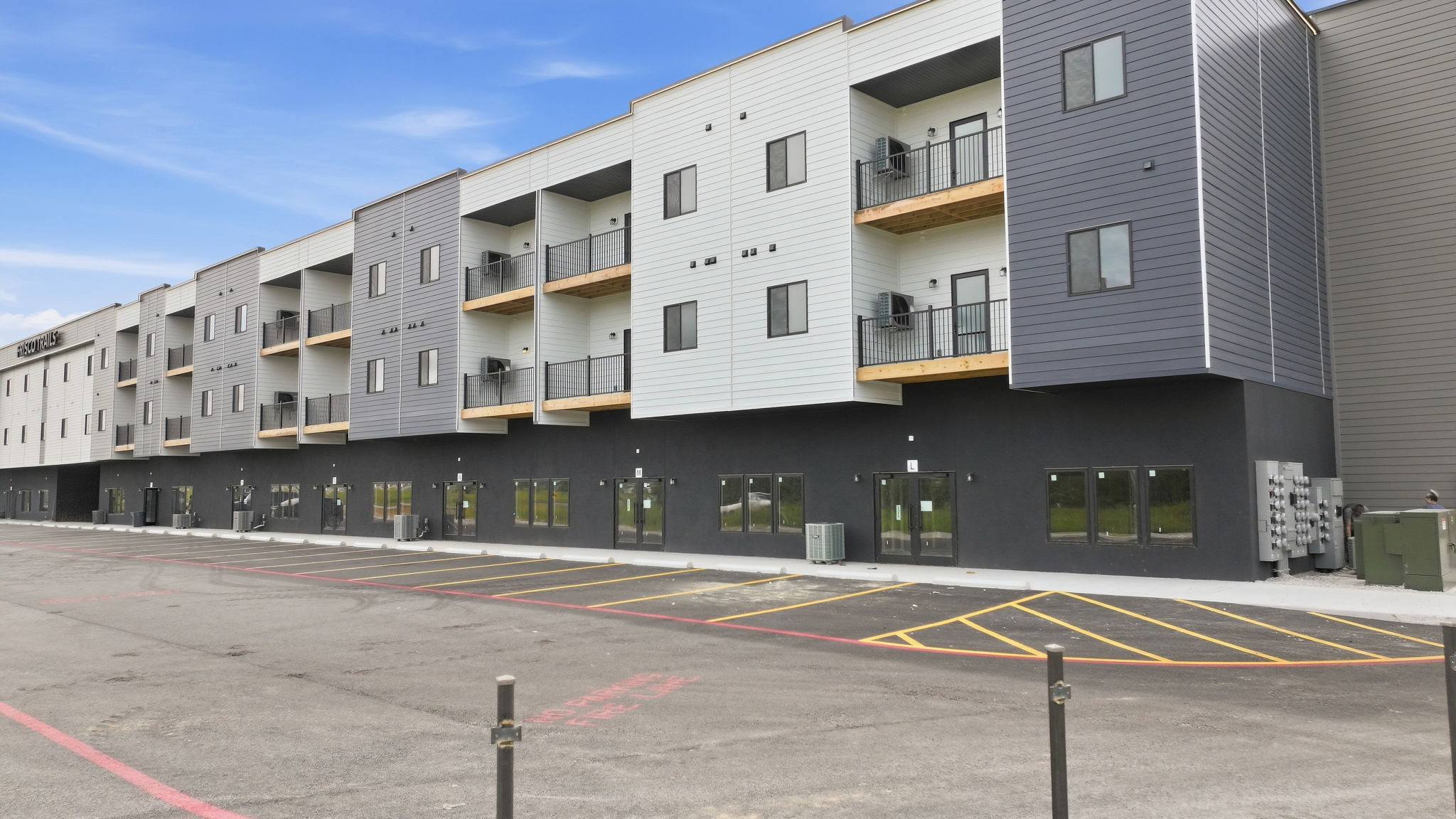 06 - Front Exterior - Balconies and Storefronts