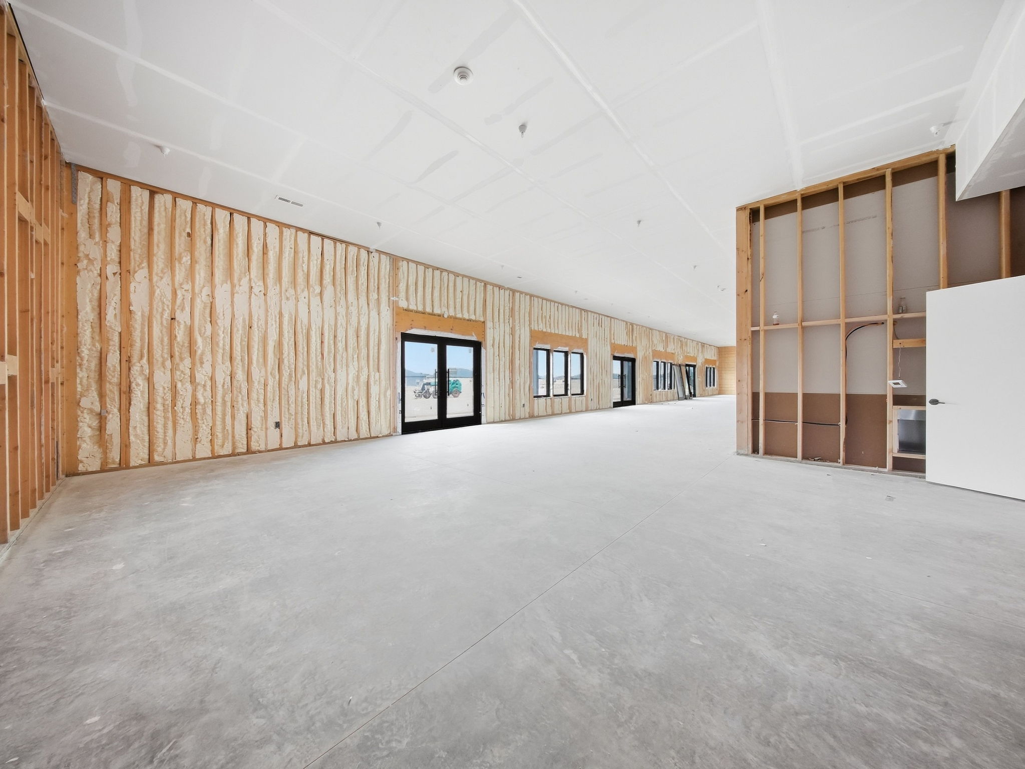 18 - Unfinished Interior - Window Wall and Framed Room