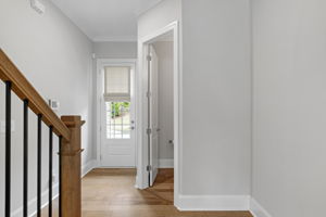 Stairs, Rear Hallway, Half Bath, and Back Entrance